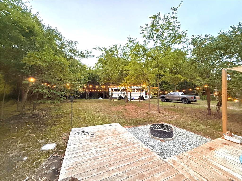 3235 County Road Cookville, TX 75558 - Photo 9 of 37 a view of a lake with houses
