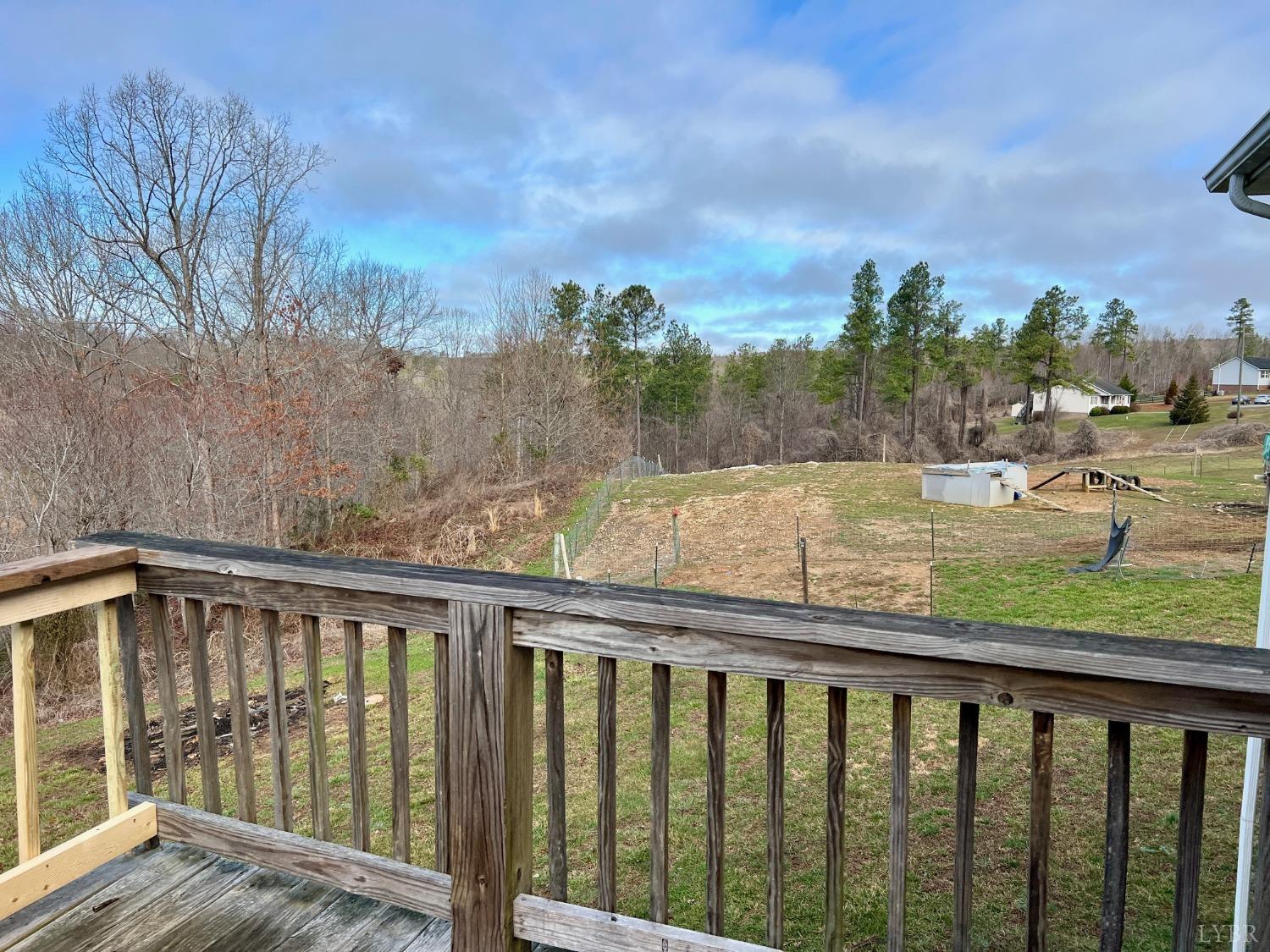 499 Reedy Spring Road Spout Spring, VA 24593 - Photo 43 of 66 a view of a balcony with wooden fence