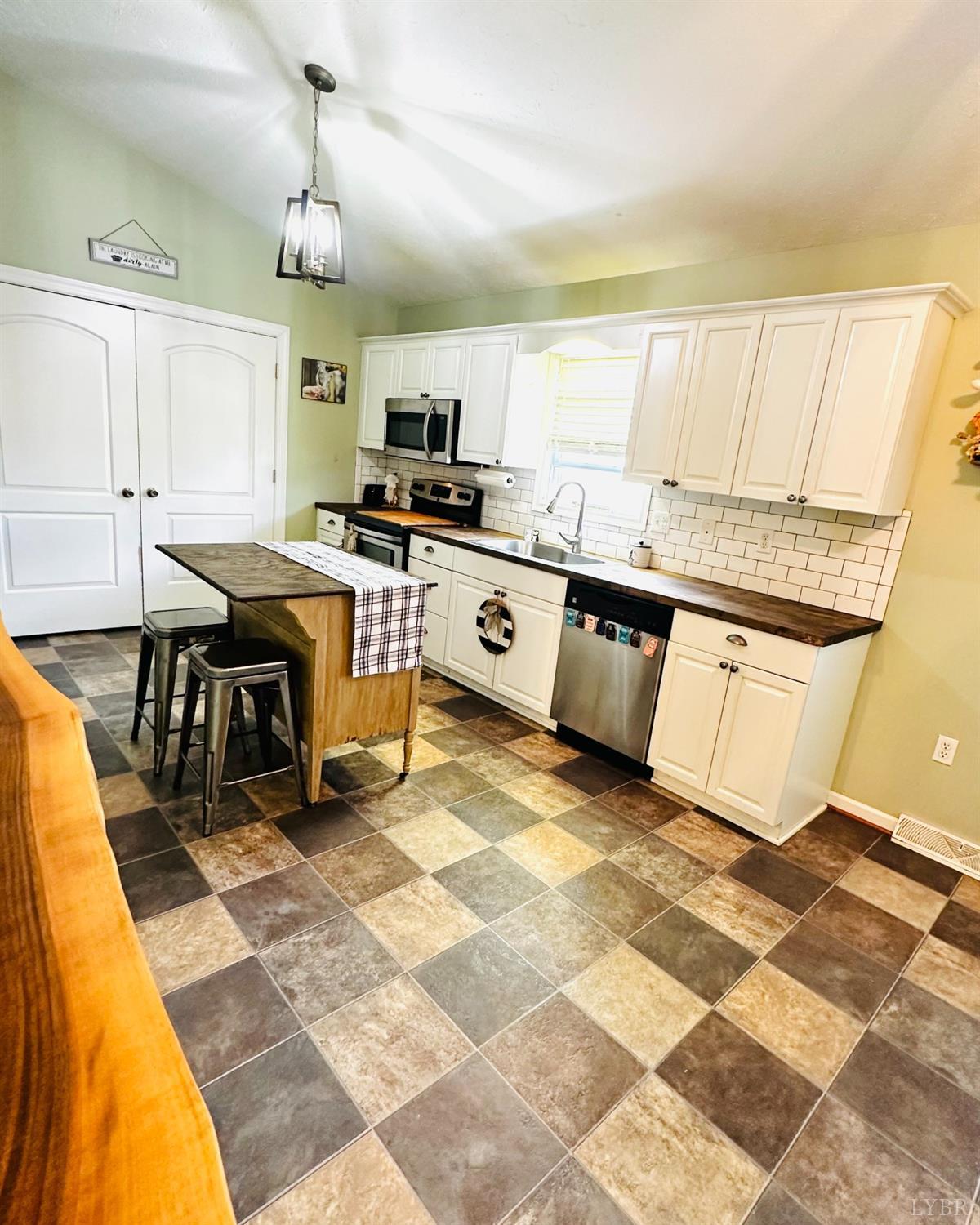 499 Reedy Spring Road Spout Spring, VA 24593 - Photo 8 of 66 a kitchen with stainless steel appliances granite countertop a sink and cabinets