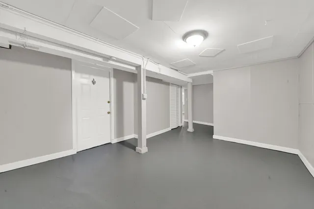 a view of a backyard with a large tree