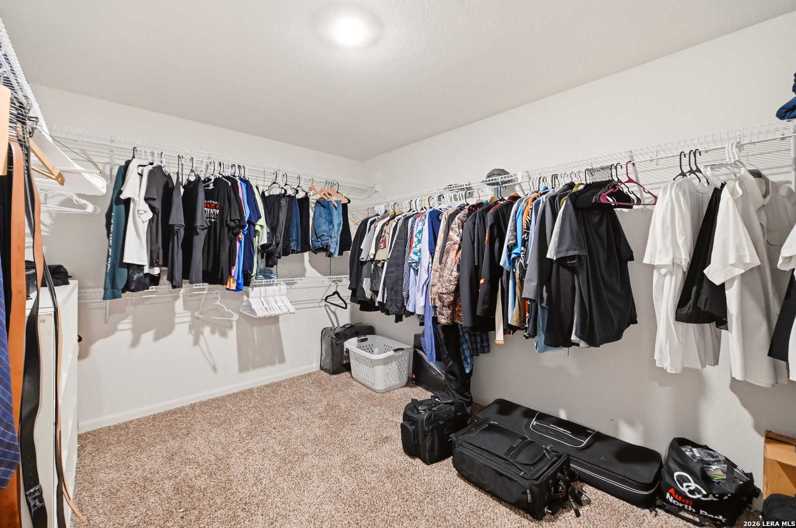 9123 Bennett Forest Converse, TX 78109 - Photo 11 of 19 a view of walk in closet with clothes and shoes