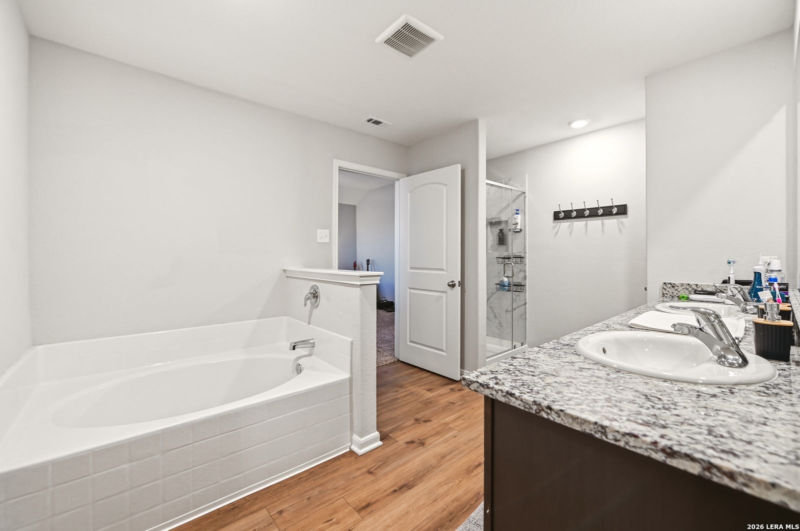 9123 Bennett Forest Converse, TX 78109 - Photo 12 of 19 a bathroom with a granite countertop tub sink and mirror