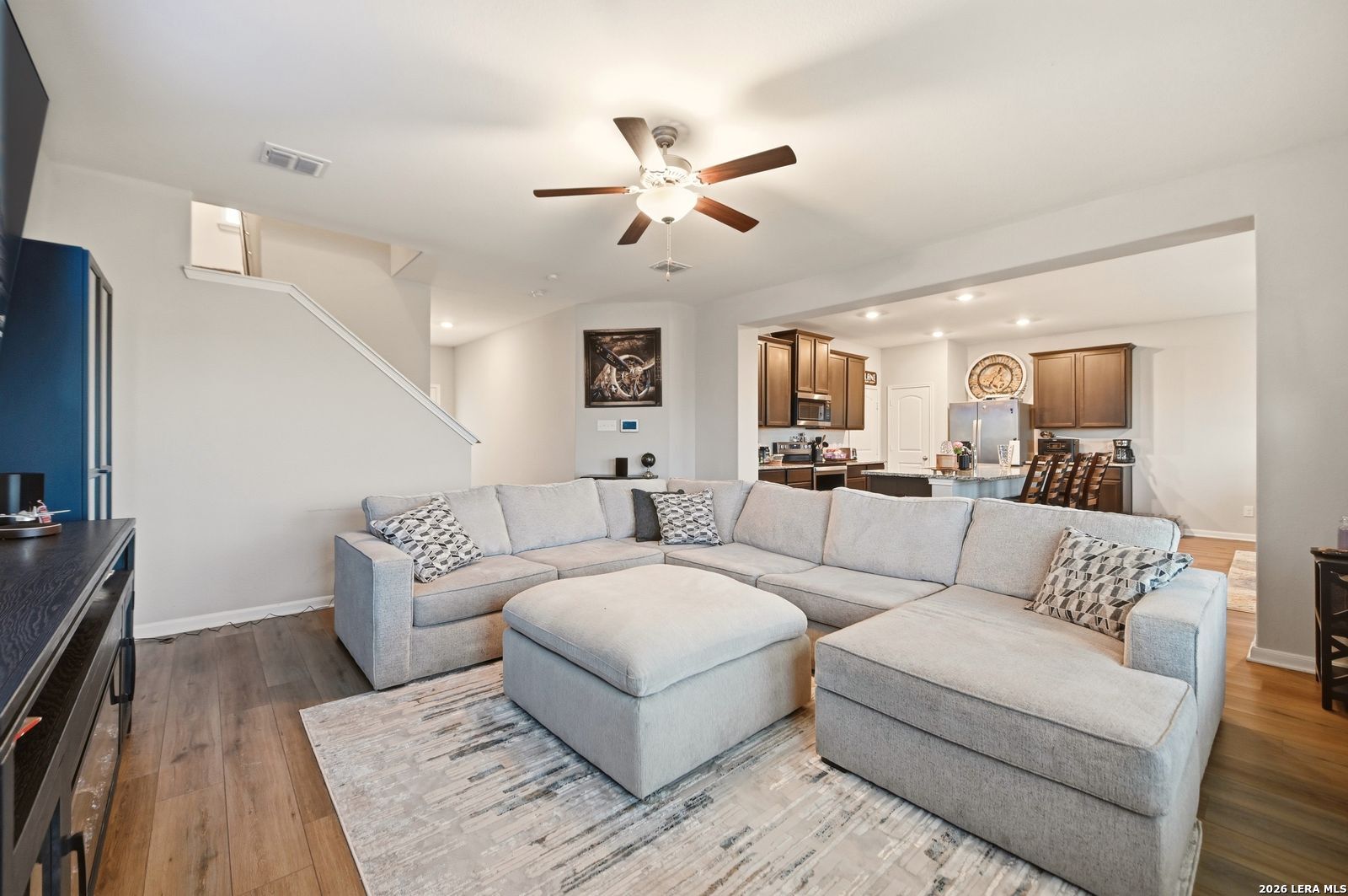 9123 Bennett Forest Converse, TX 78109 - Photo 6 of 19 a living room with couches and a view of kitchen