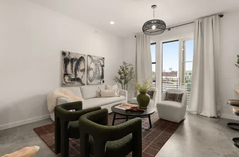 a living room with furniture and a table