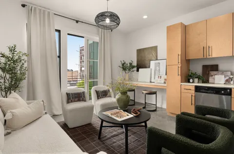 a kitchen with stainless steel appliances granite countertop a refrigerator sink and stove