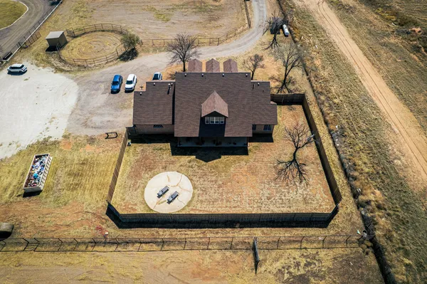 a spacious bedroom with a bed and a chandelier