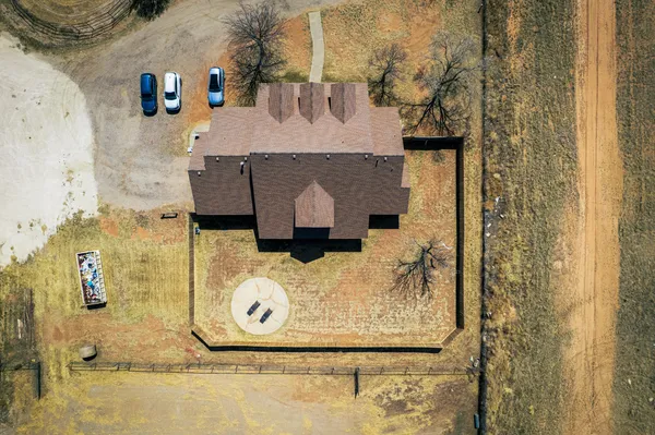 a view of a hallway with stairs and furniture