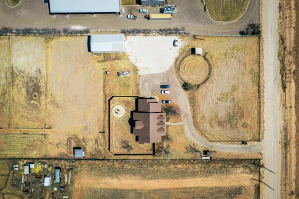 a living room with a fireplace and a floor to ceiling window