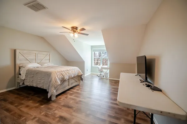 a kitchen with granite countertop a sink a stove and cabinets