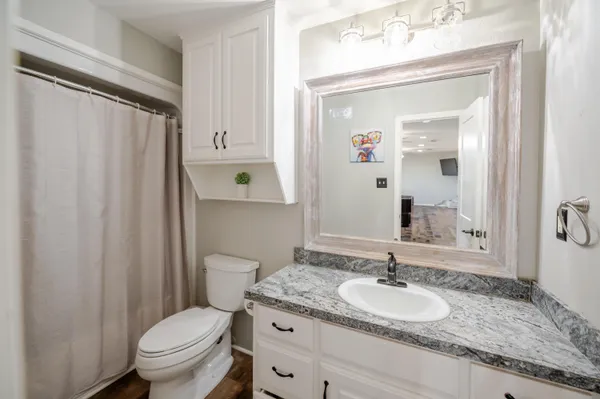 a very nice looking kitchen with a large window a dining table and chairs