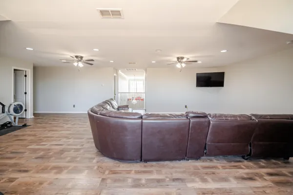 a kitchen with stainless steel appliances granite countertop a sink stove and wooden floor