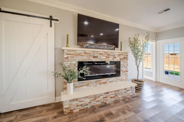 a bathroom with a granite countertop sink and a large mirror