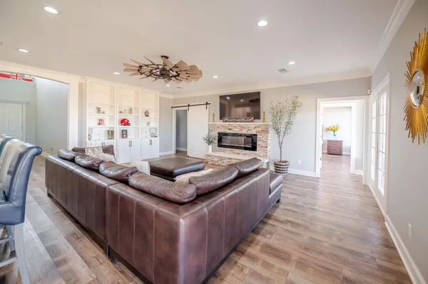 an aerial view of residential houses with outdoor space and ocean
