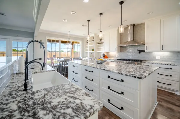 an aerial view of a house with swimming pool and ocean view