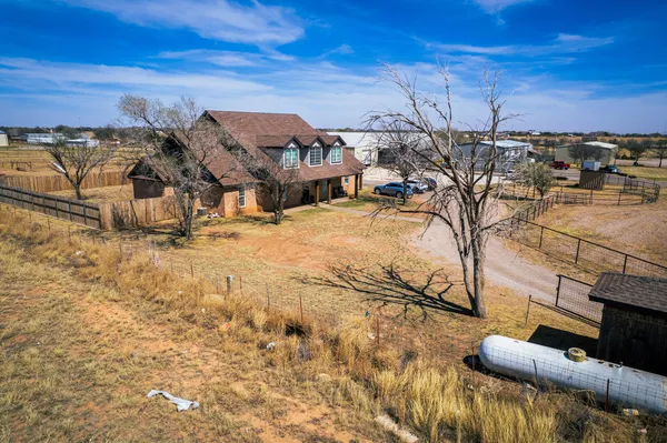 a bed room with a bed and a ceiling fan