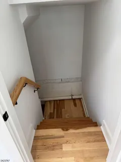 a view of room with window and stairs