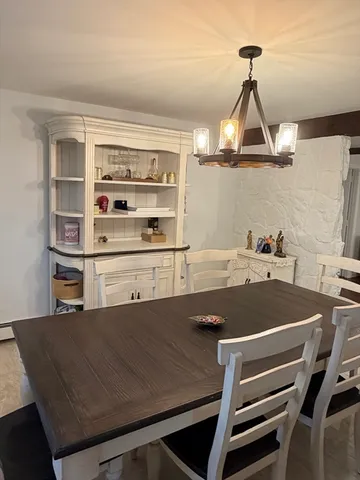 a view of a dining room and chairs
