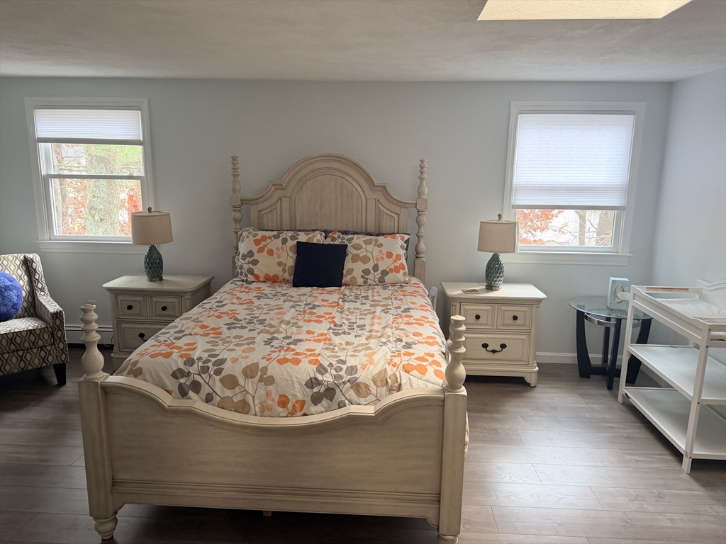 18 Boxford Road Topsfield, MA 01983 - Photo 25 of 37 a bed sitting in a bedroom next to a window