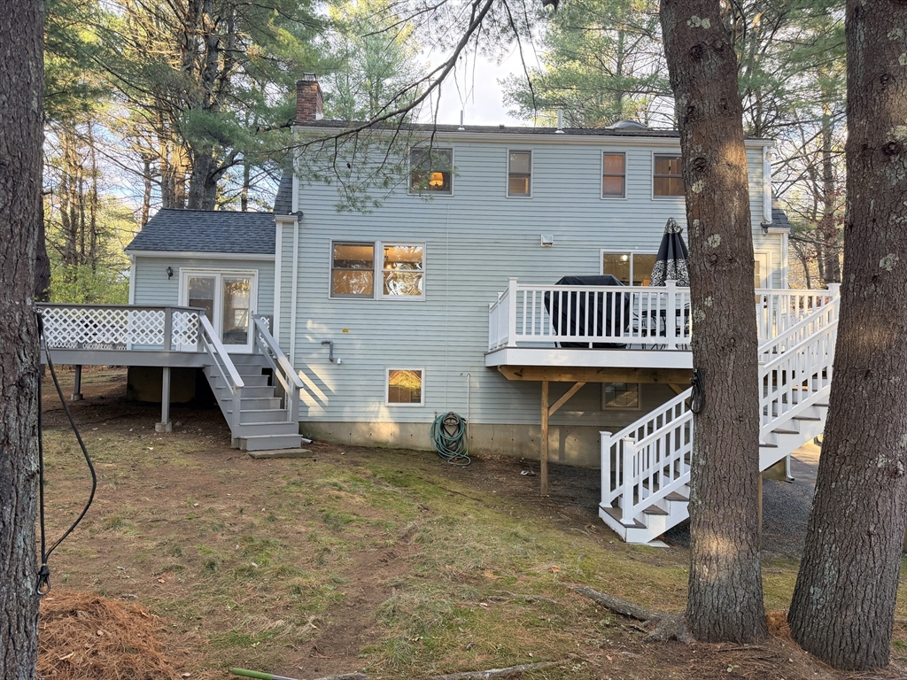 18 Boxford Road Topsfield, MA 01983 - Photo 3 of 37 a view of a patio with a table and chairs