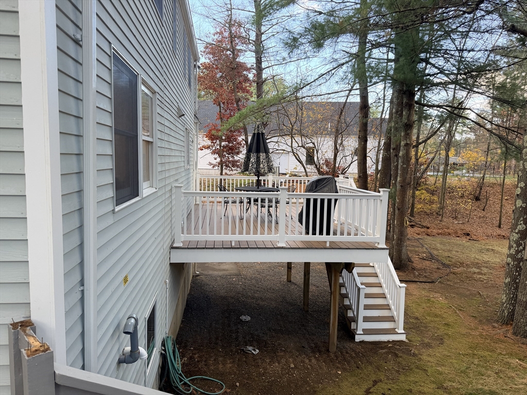 18 Boxford Road Topsfield, MA 01983 - Photo 8 of 37 a view of a house with a deck