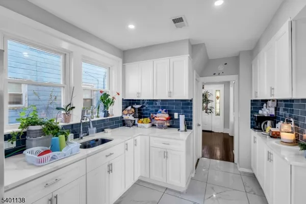 a kitchen with sink cabinets and window