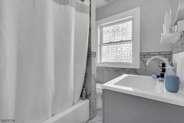 a bathroom with a sink and a bathtub