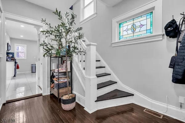 a view of entryway with wooden floor