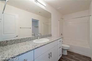 12347 Indigo Montage Road, Unit 3 Las Vegas, NV 89183 - Photo 7 of 23 White cabinetry, a spacious vanity, and a shower/tub combo complete this contemporary bathroom.