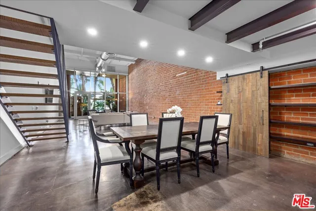 a living room with fireplace furniture and a flat screen tv