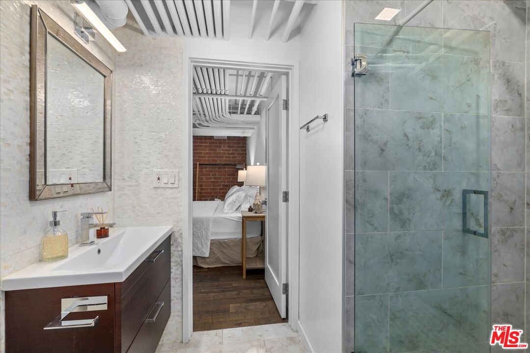 120 South Hewitt Street, Unit 6 Los Angeles, CA 90012 - Photo 31 of 48 a bathroom with a sink toilet and shower