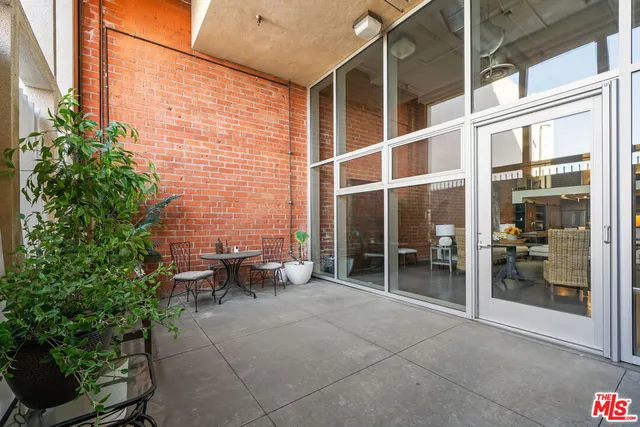 a front view of a house with cars parked