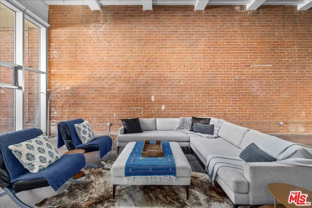 a living room with furniture and a rug