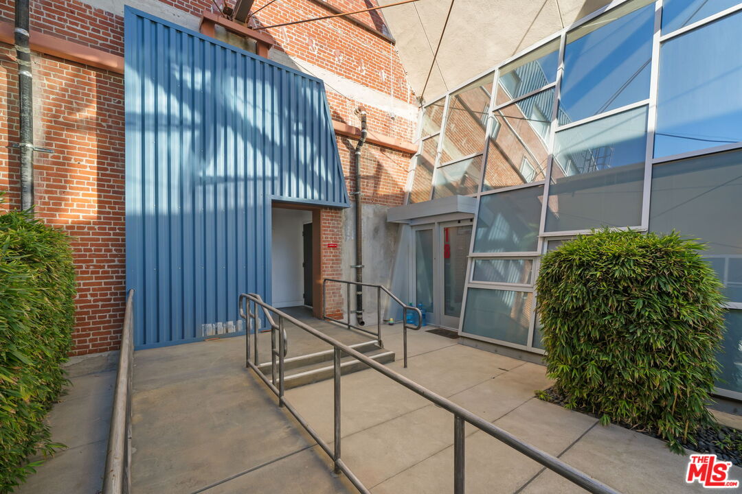 120 South Hewitt Street, Unit 6 Los Angeles, CA 90012 - Photo 43 of 48 a view of a house with backyard and sitting area