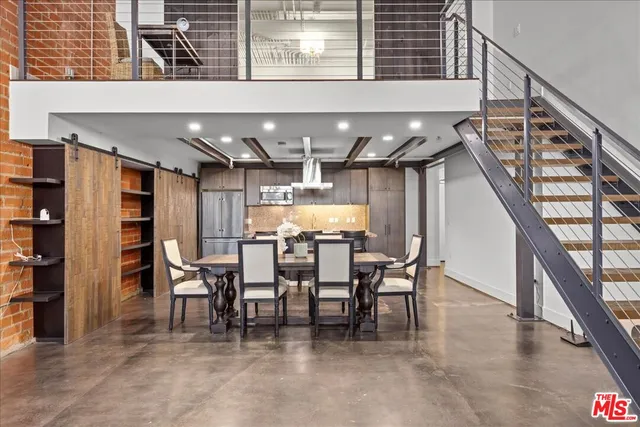 a dining room with furniture and a chandelier