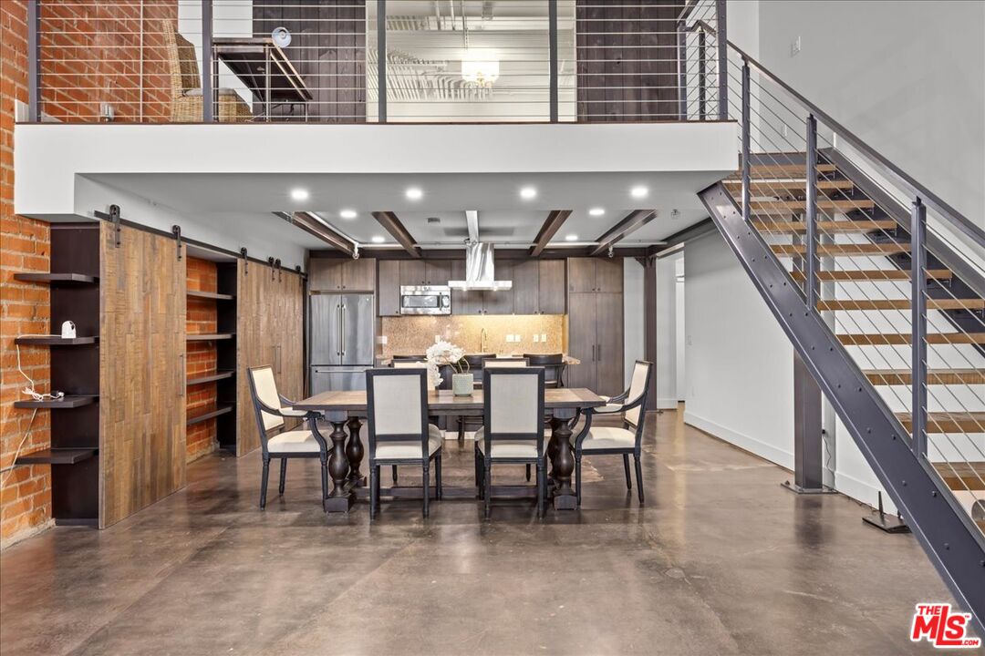 120 South Hewitt Street, Unit 6 Los Angeles, CA 90012 - Photo 6 of 48 a dining room with furniture and a chandelier