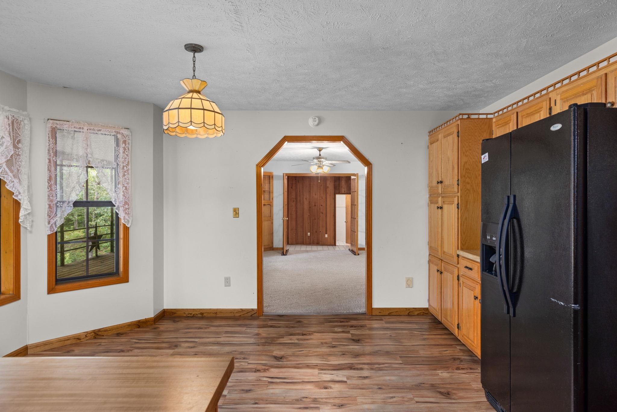 165 Highway 201 Reagan, TN 38368 - Photo 18 of 40 wooden floor in an empty room with a window