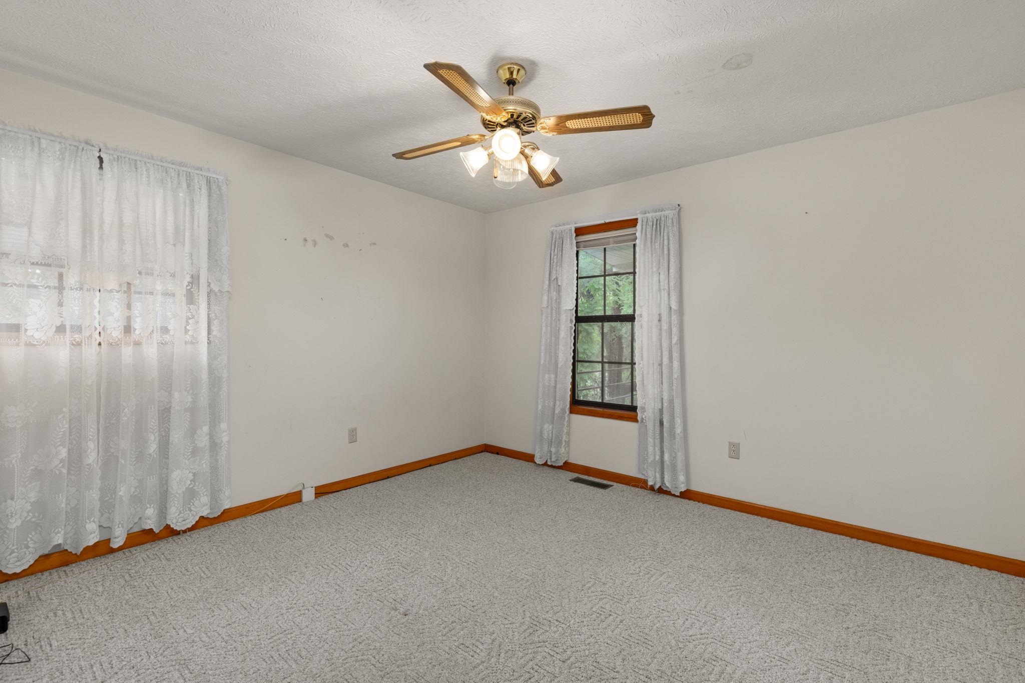 165 Highway 201 Reagan, TN 38368 - Photo 21 of 40 an empty room with windows and fan