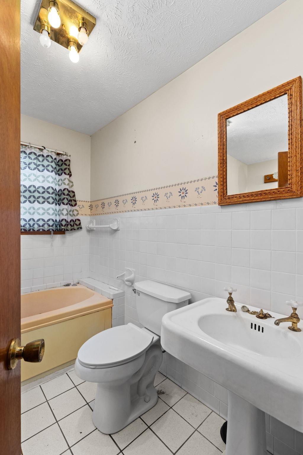 165 Highway 201 Reagan, TN 38368 - Photo 22 of 40 a bathroom with a toilet a sink and mirror