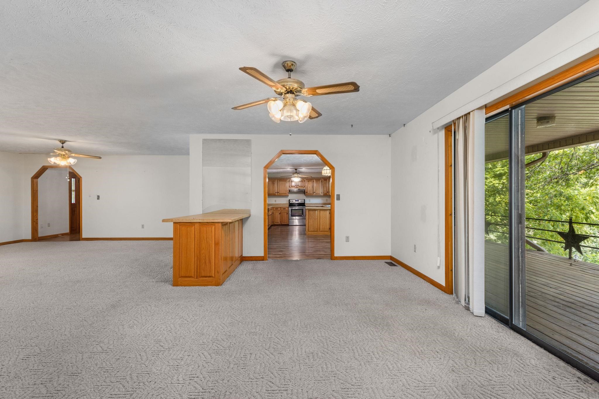 165 Highway 201 Reagan, TN 38368 - Photo 6 of 40 an empty room with windows and ceiling fan