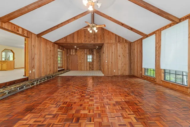 a view of entryway with wooden floor and stairs