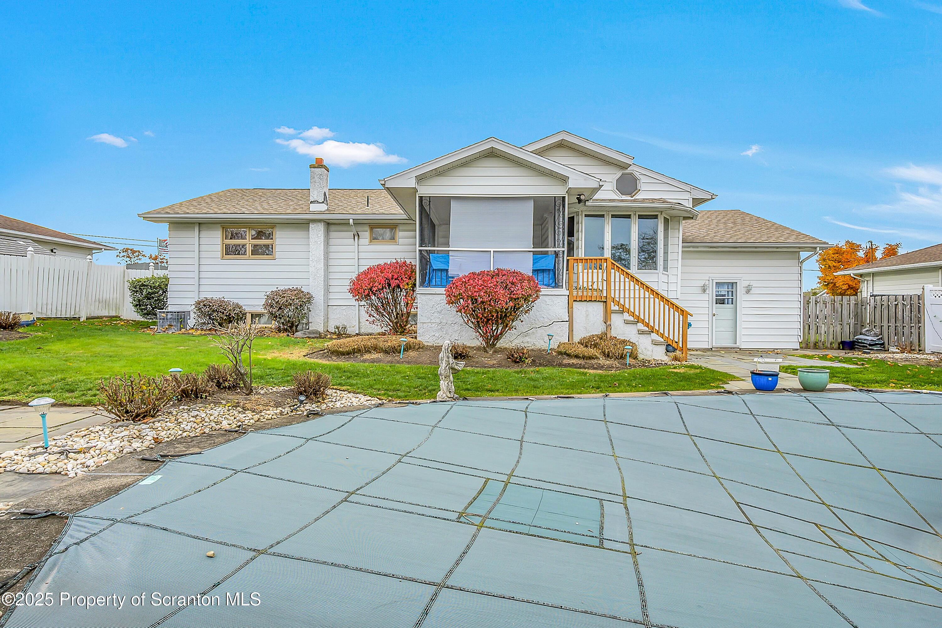 807 Marion Lane Moosic, PA 18507 - Photo 18 of 42 a view of a house with a yard and potted plants