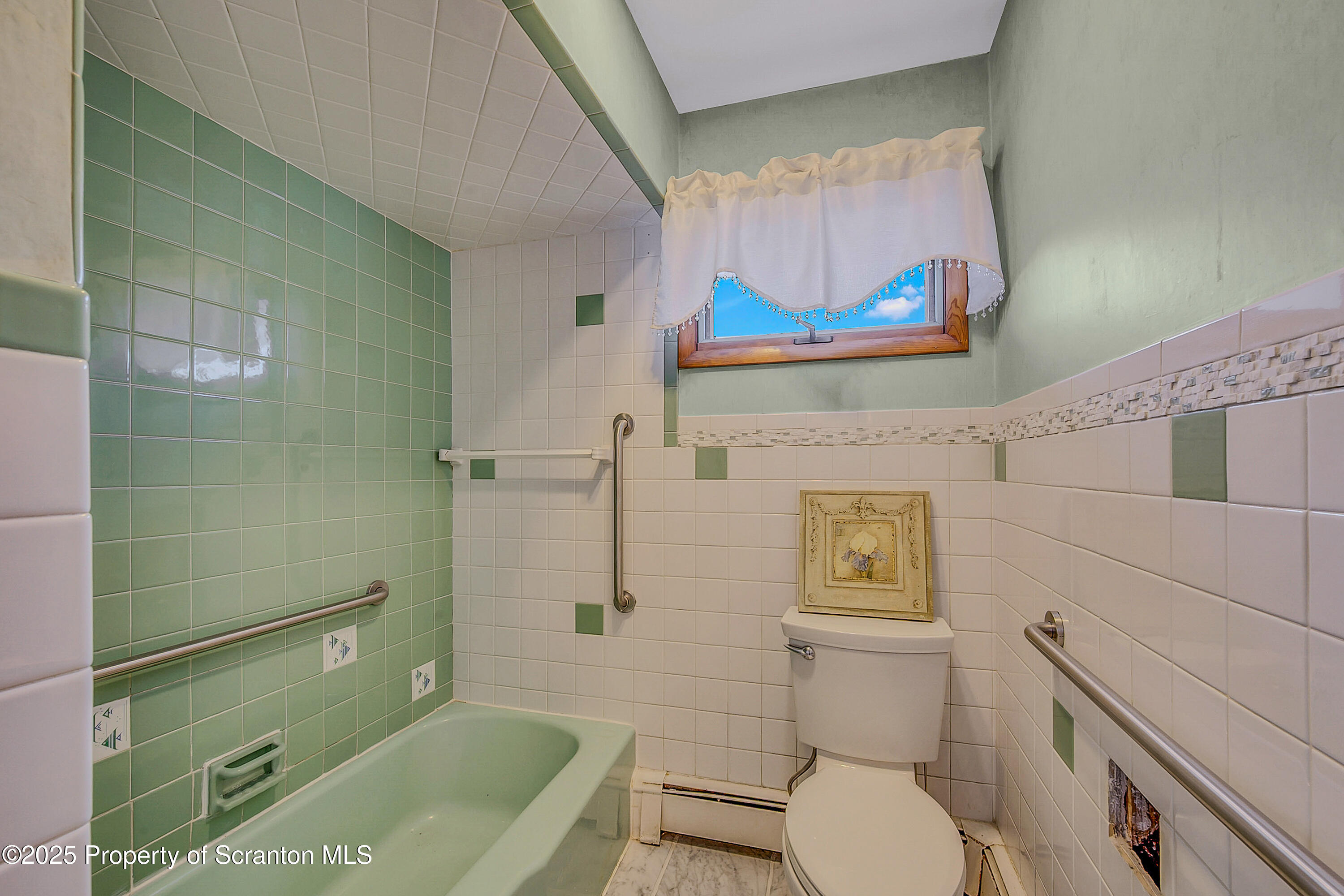 807 Marion Lane Moosic, PA 18507 - Photo 22 of 42 a bathroom with a toilet a sink and mirror