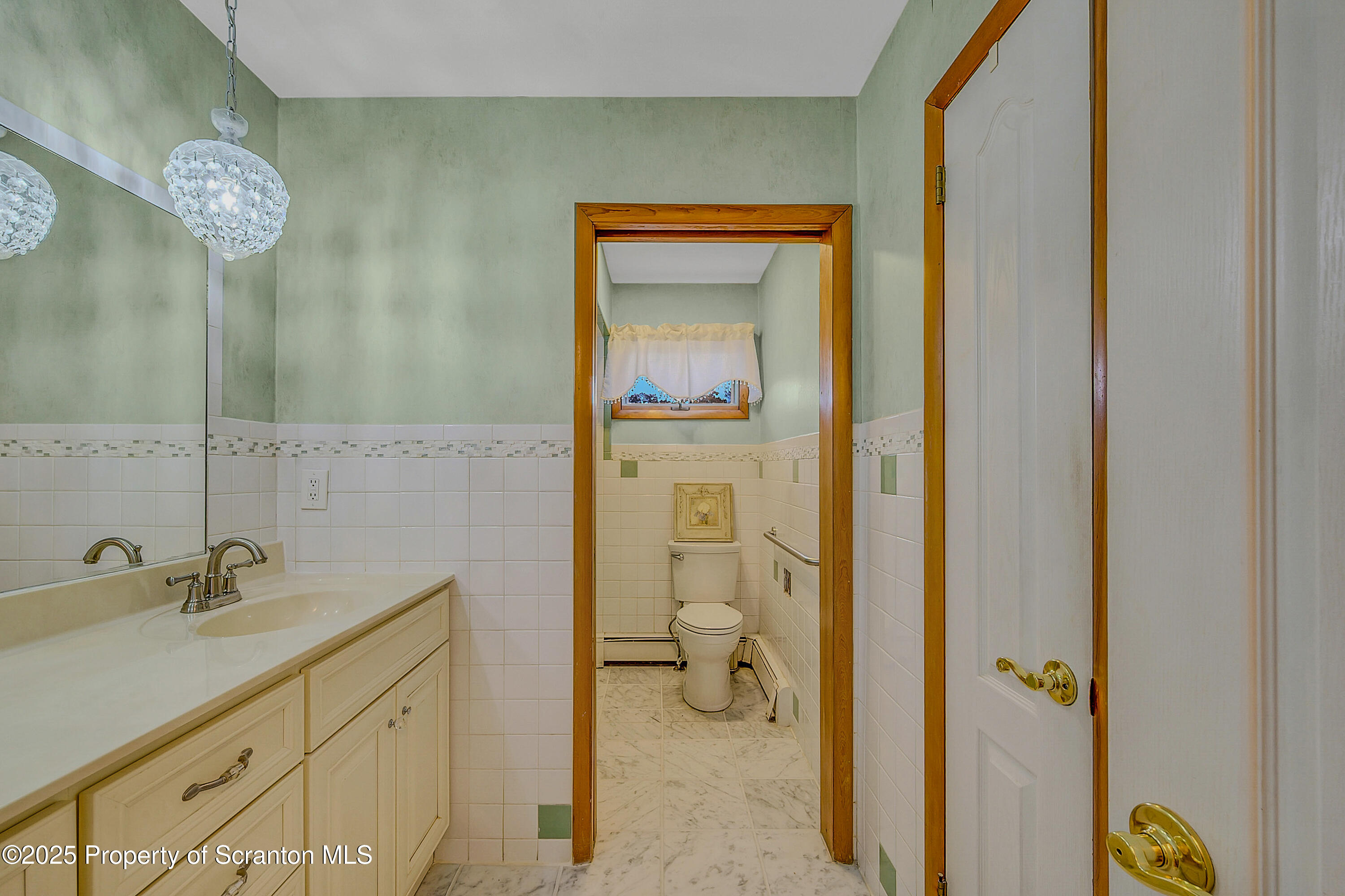 807 Marion Lane Moosic, PA 18507 - Photo 24 of 42 a bathroom with a sink and a mirror