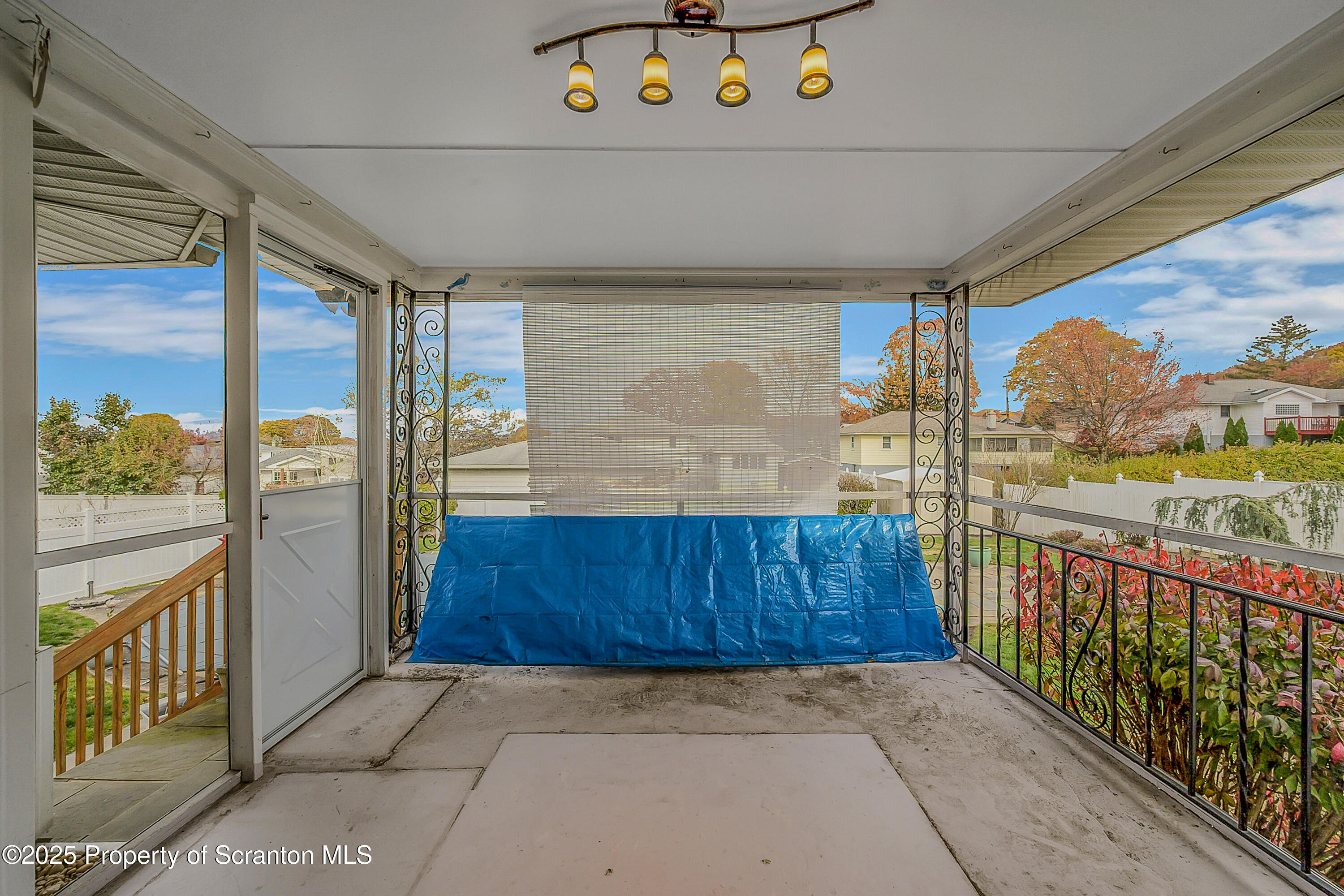 807 Marion Lane Moosic, PA 18507 - Photo 31 of 42 a view of a porch with furniture and floor to ceiling window