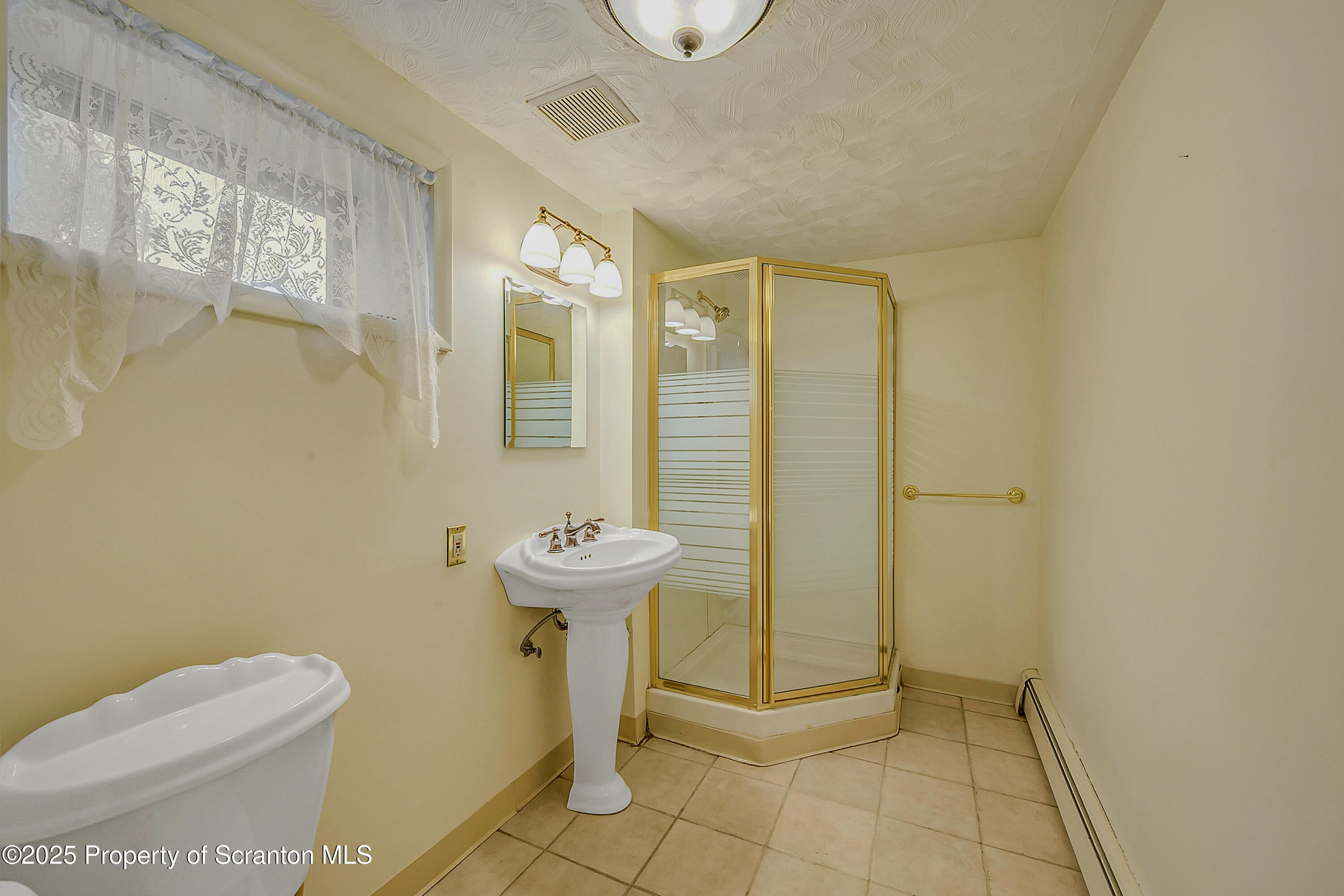 807 Marion Lane Moosic, PA 18507 - Photo 39 of 42 a bathroom with a sink toilet and shower