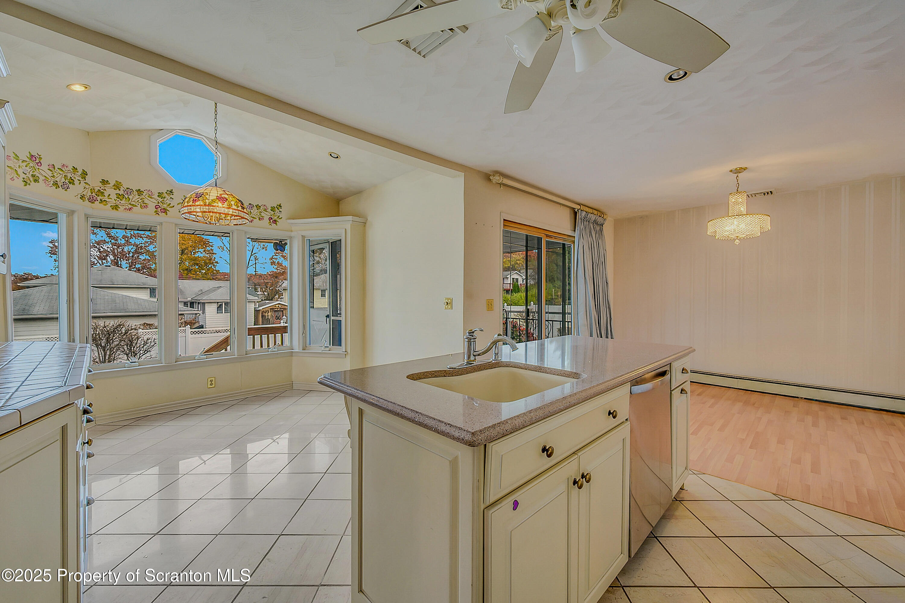 807 Marion Lane Moosic, PA 18507 - Photo 8 of 42 a spacious bathroom with a granite countertop sink and a mirror