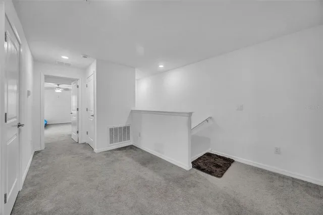 a bathroom with a granite countertop sink a toilet a mirror and shower