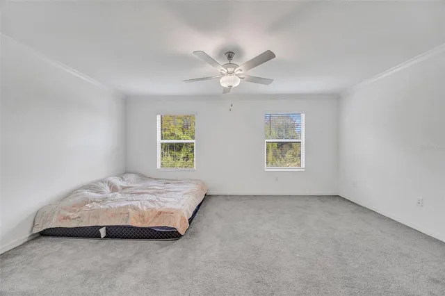 a view of a room with yard wooden floor and windows