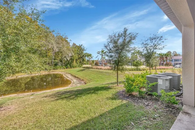 an aerial view of a house with a swimming pool