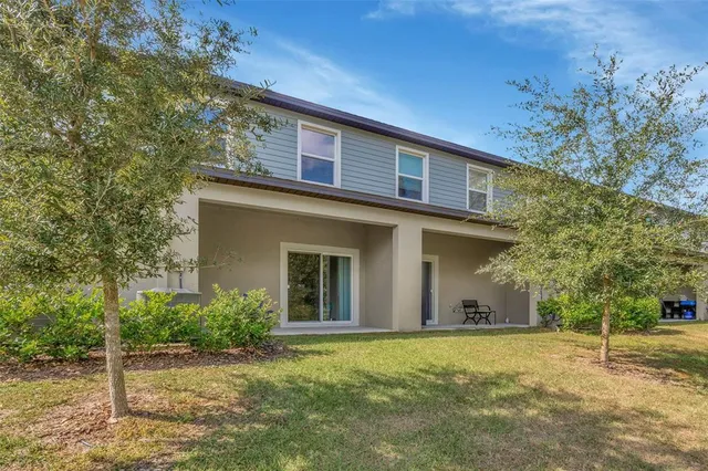 an aerial view of residential house with outdoor space and swimming pool